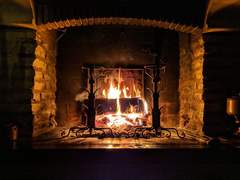 Beautiful property with a wood fireplace at home for sale, offering comfort and style
